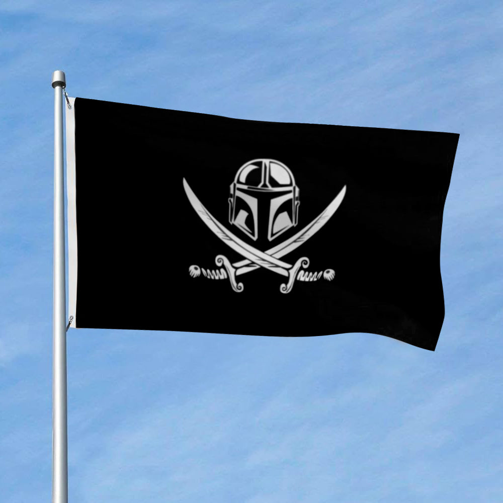 Black flag with white Mandalorian helmet above crossed pirate swords, displayed outdoors on a pole.