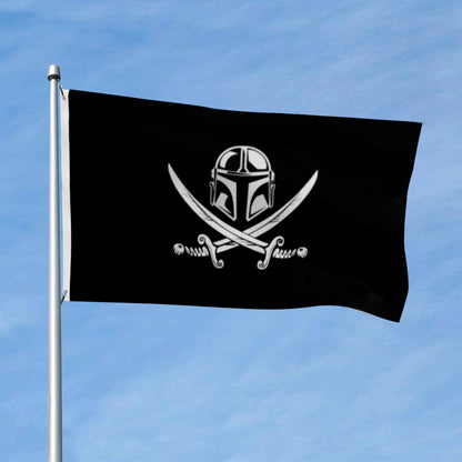 Black flag with white Mandalorian helmet above crossed pirate swords, displayed outdoors on a pole.